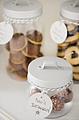 Biscuits and pralines in glass jars