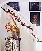 Garland of ivy and autumn leaves wound along banister