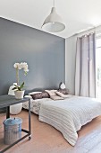 Elegant bedroom in soft earthy shades with grey wall