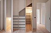 Illuminates fitted cupboards in renovated designer apartment
