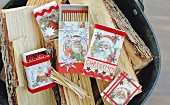 Matchboxes covered in vintage-style Father-Christmas-patterned paper