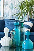 Glass flacons with ball closure in different shades of blue