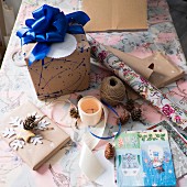 Wrapping materials and wrapped gift with blue ribbon