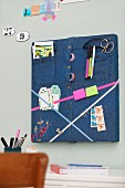 Square pinboard made from denim shirt and ribbons
