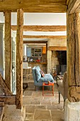 Rustic living area with stone floor and exposed beams