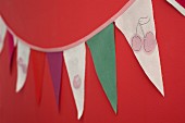 Bunting hand-made from fabric remnants with painted cherry motifs