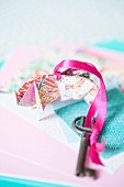 Key fob made from colourful origami paper and pink ribbon