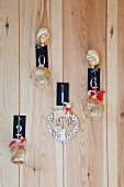 Christmas decorations and numbered signs hung on wooden wall