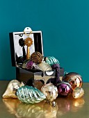 Traditional Christmas decorations in open box and on brass surface