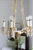 Vintage-style brass chandelier with light bulbs