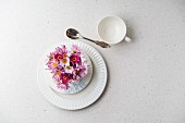 White place setting decorated with flowers and name