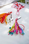 Homemade tassels made of colourful ribbons as a pendant for keys or memory sticks