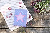 Books with appliqué star on hand-sewn cover