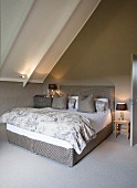 Attic bedroom in shades of grey