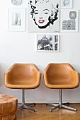Gallery of pictures above two retro chairs covered in pale brown leather