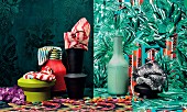 Colourful patterned fabrics, wallpaper and vases