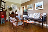 bench and upholstered chairs in eclectic living room