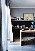 Blowing curtains in the masculine home office