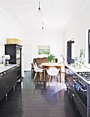 Eclectic dining area in black kitchen