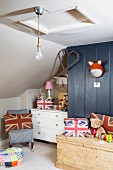 Child's bedroom with sloping ceiling an Union Flag motifs