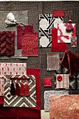 Mood board of fabrics in shades of red and grey