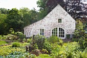 Gable-end wall of traditional country house in garden