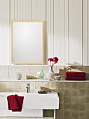 Beige-coloured striped non-woven wallpaper and tiled facing with a shelf in a bathroom