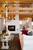 Fireplace, gallery and festive Advent atmosphere in open-plan living area of country house