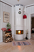 Roaring fire in round Swedish stove