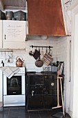 Old kitchen cooker with copper extractor hood