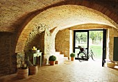 Bicycle in vaulted brick foyer