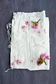 Pink cherry blossom on white fabric