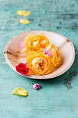 Edible yellow rose petals on plate