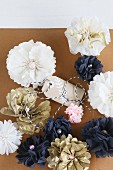 Gold, white and blue tissue-paper flowers