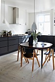 Black and white Scandinavian-style kitchen-dining room
