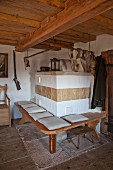 Tiled stove with bench in historical farmhouse