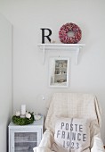 Vintage-style seating corner with vintage printed scatter cushion