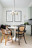 White Tulip Table, black bentwood chairs and retro lamp in dining area