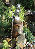 Water feature, Garden Gnome sitting on amphora