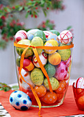 Large glass vase with colorful easter eggs