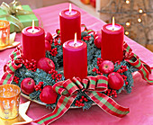 Advent wreath with ilex and apples