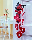 Paper, sisal and felt hearts, text 'My Sweetheart', petals