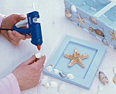 Picture frame with starfish and shells -