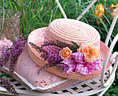 Hat with rose and buddleia