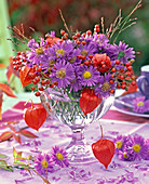 Asters with berries and fruits bouquet
