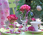 Single pinks (rose petals), hedera (ivy) in glasses