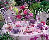 Etagere with pink and syringa on covered tea table