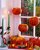 Pumpkins as lanterns in the window