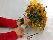 Bouquet with autumn crysanthemums and oak leaves