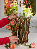 Plug-in aid from branches of roses and rowan berries